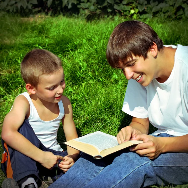 Brothers reads a Book — Stock Photo, Image