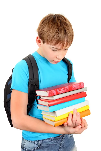 Bir kitap ile üzgün okul çocuğu — Stok fotoğraf