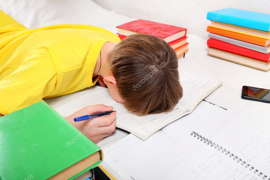 Tired Teenager doing Homework