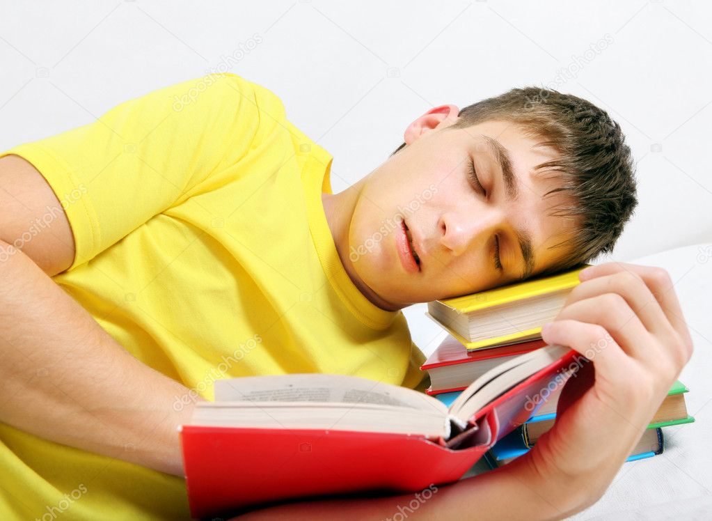 Tired Teenager sleep on the Books