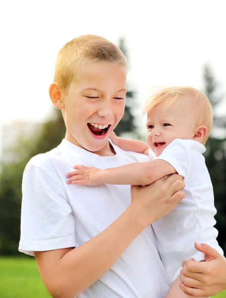 Happy Kid and Baby outdoor — Stock Photo, Image