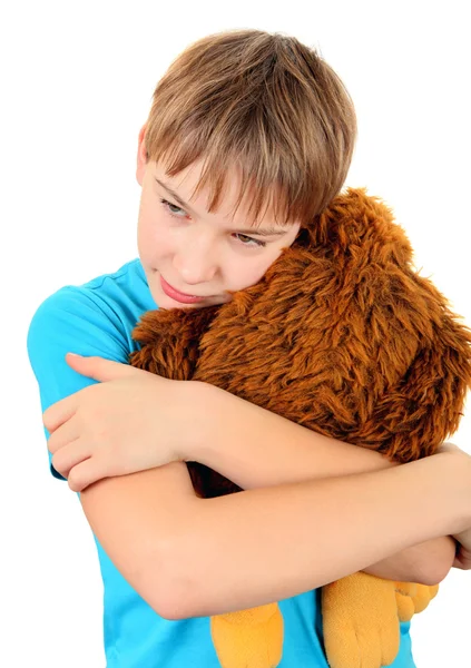 Triste chico con un juguete de peluche — Foto de Stock