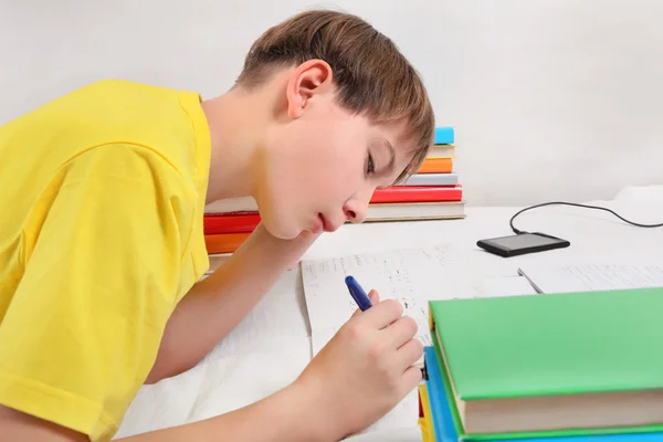 Teenager doing Homework Stock Image