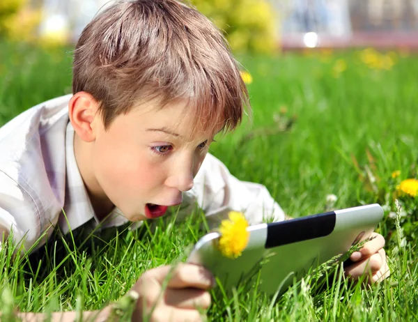Surprised Kid with Tablet — Stock Photo, Image