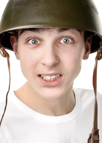 Teenager in a Military Helmet Royalty Free Stock Images