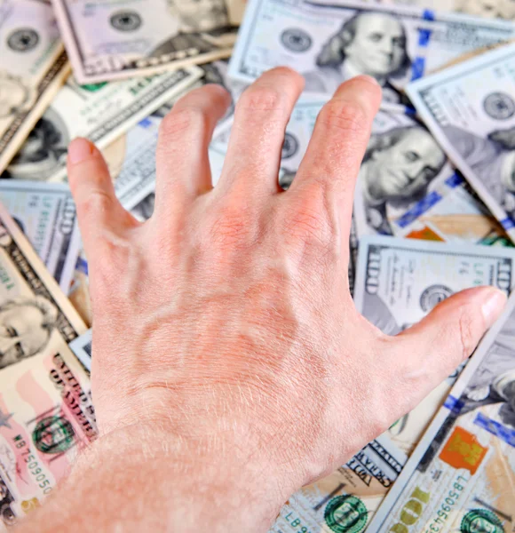 Hand op het geld — Stockfoto