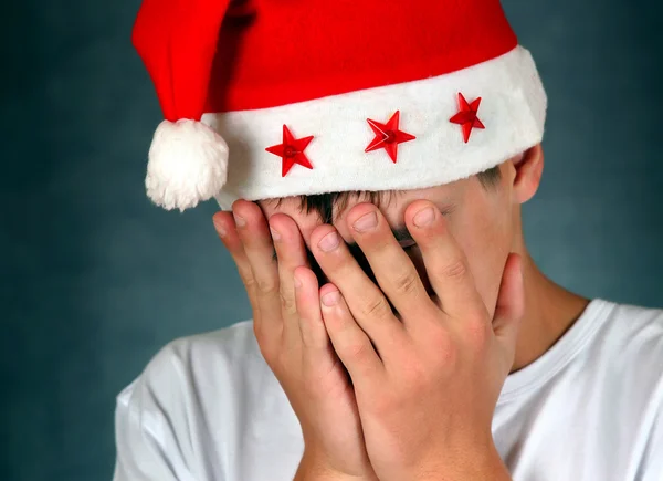 サンタの帽子で悲しいティーンエイ ジャー — ストック写真
