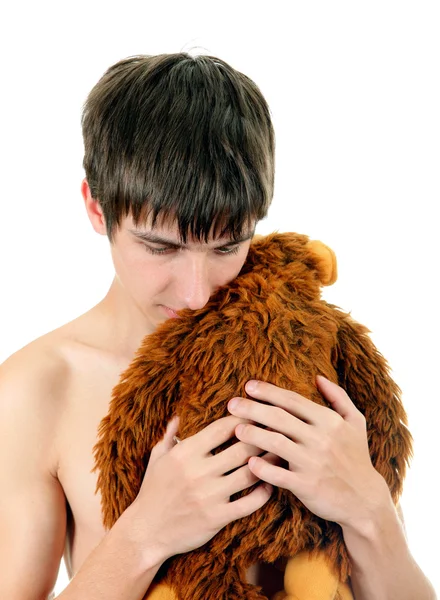 Joven con juguete de peluche — Foto de Stock