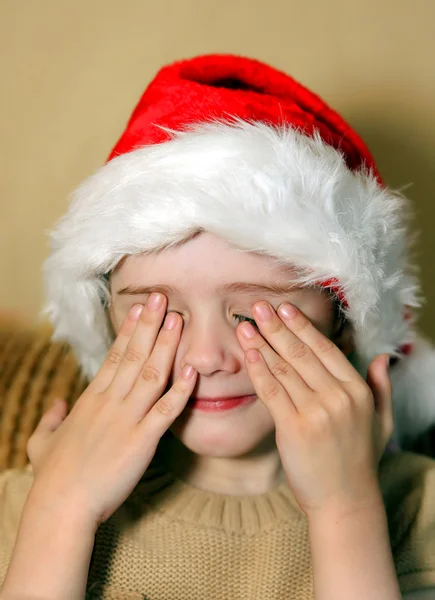 Noel Baba şapkası üzgün kız — Stok fotoğraf