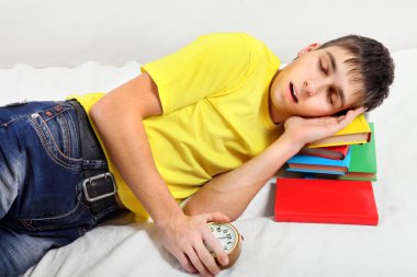 Tired Teenager sleep on the Books clipart