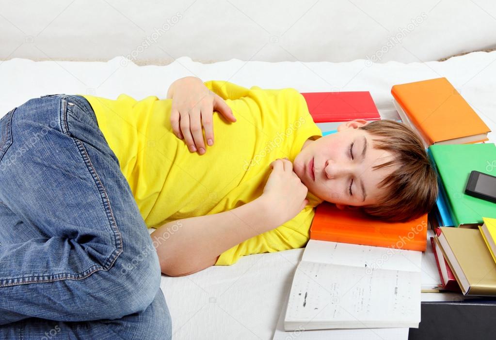 Tired Kid sleep on the Books