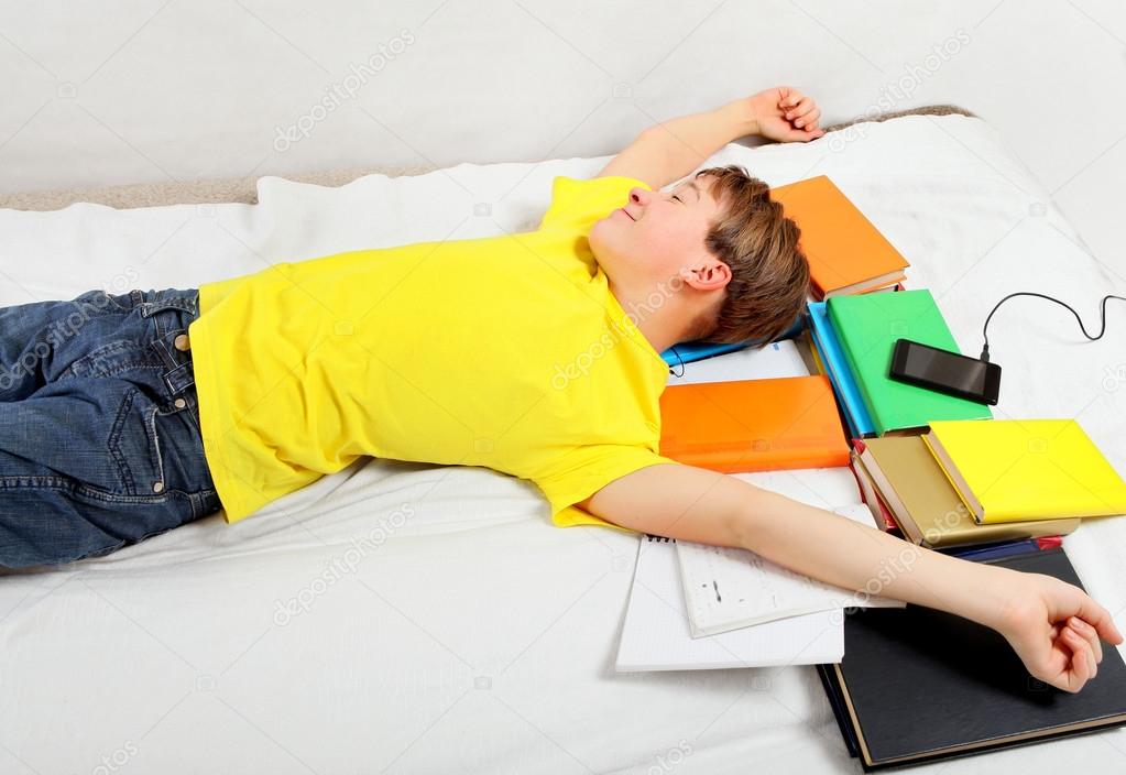 Tired Kid sleep on the Books