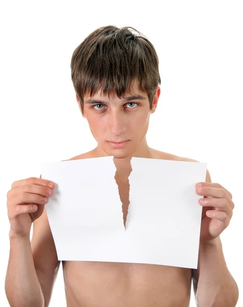 Junger Mann mit zerrissenem Papier — Stockfoto