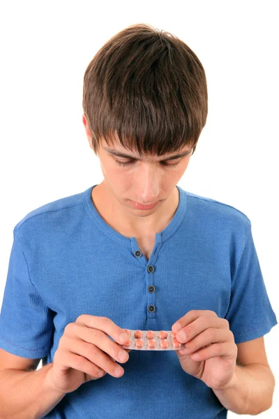 Joven con las píldoras — Foto de Stock