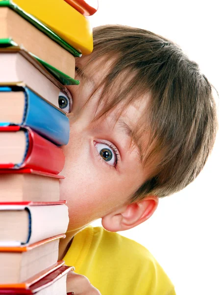 Surprised Kid behind the Books Stock Photo