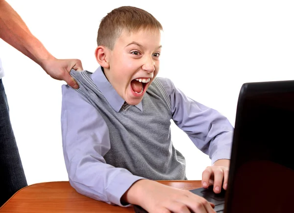 Parent dragging Son from Laptop — Stock Photo, Image