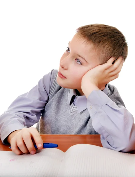 Gelangweiltes Kind macht Hausaufgaben — Stockfoto
