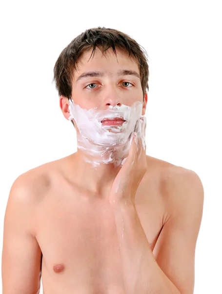 Młody człowiek z krem do golenia — Zdjęcie stockowe