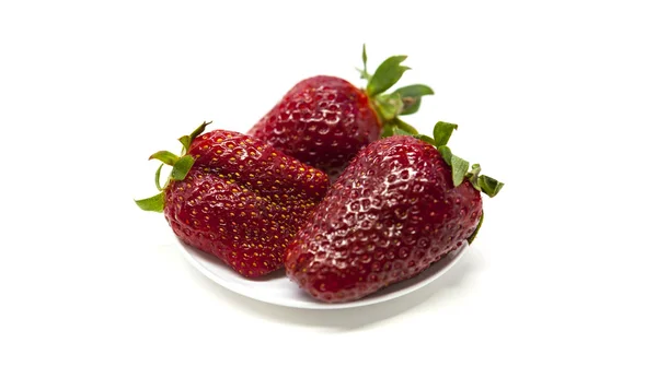 Fresh strawberries on a plate on white background — Stock Photo, Image