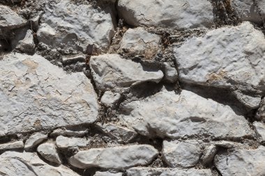 Büyük bir taş duvardan bazalt dokulu. İyi bir arka plan duvar kağıdı için.