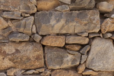 Büyük bir taş duvardan bazalt dokulu. İyi bir arka plan duvar kağıdı için.