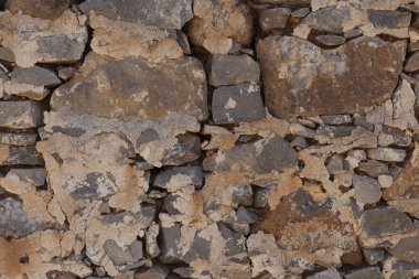 Büyük bir taş duvardan bazalt dokulu. İyi bir arka plan duvar kağıdı için.