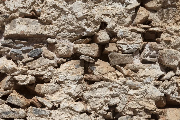 Büyük bir taş duvardan bazalt dokulu. İyi bir arka plan duvar kağıdı için.