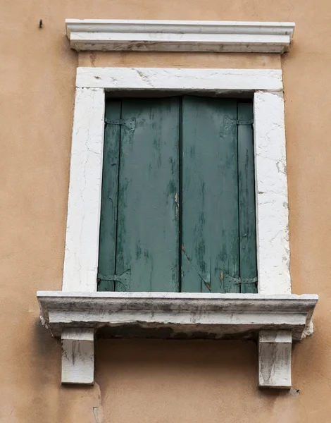 Old window with closed shutters on the window sill on the stone wall. Italian Village — Stock Photo, Image