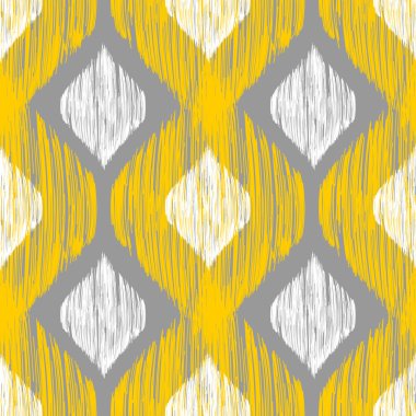 Yellow, white and grey rhomb seamless pattern in native ikat style.