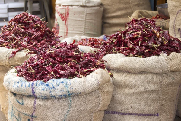 Dried red chili peppers in sacks in India Goa — Stock Photo, Image