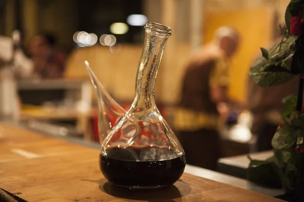 Red Spanish wine in a beautiful glass carafe decanter — Stock Photo, Image