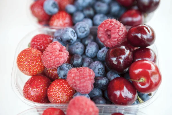 Fresh , raspberries, strawberries, cherries, blueberries in the box on the market — Stock Photo, Image