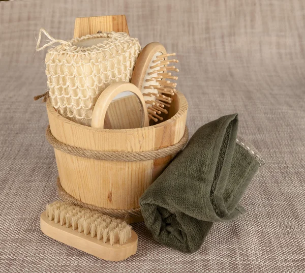 Small wooden spa set, sponge, pumice stone, a mirror, towel, brush, comb — Stock Photo, Image