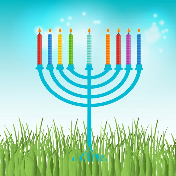 Hanukkah menora with  candles on blue sky and green grass background