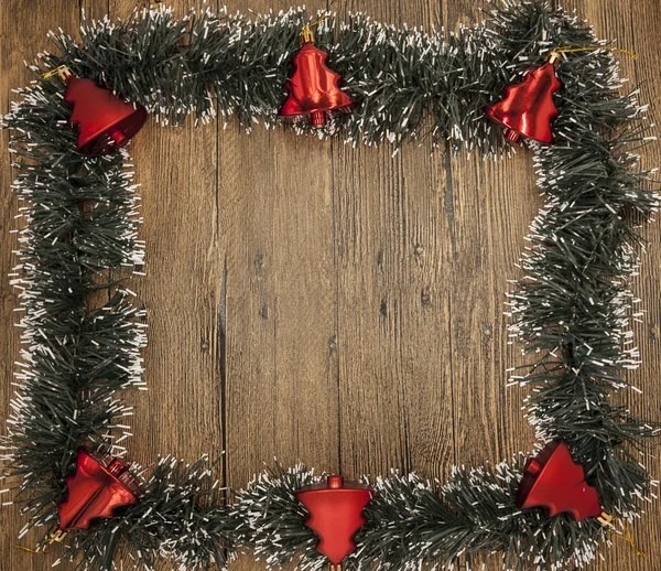 Christmas card with a fringe of branches of Christmas trees and festive toys on branches — Stock Fotó