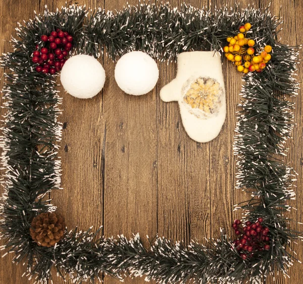 Christmas card from Christmas trees and clusters of mountain ash children's mittens and snowballs — Stock Photo, Image