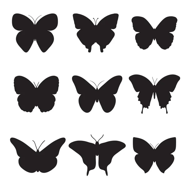 Schwarze Schmetterlinge auf weißem Hintergrund. — Stockvektor