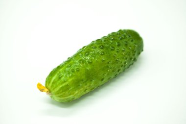 Fresh appetizing tasty cucumber on a white background.