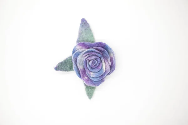 Beautiful blue rose flower milled wool on a white background. — Stock fotografie