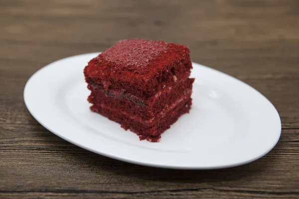 Red Velvet, fresh delicious diet cake  at Dukan Diet on a porcelain plate on a wooden background. — Stock Fotó