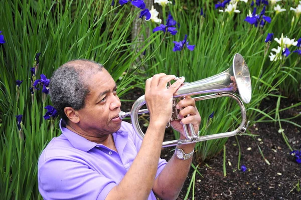 African American Male Jazz Musician Blowing His Flugelhorn Flower Garden — Stock Photo, Image
