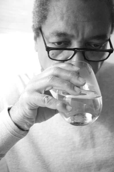 African American Male Senior Taking His Medication Home — Stock Photo, Image