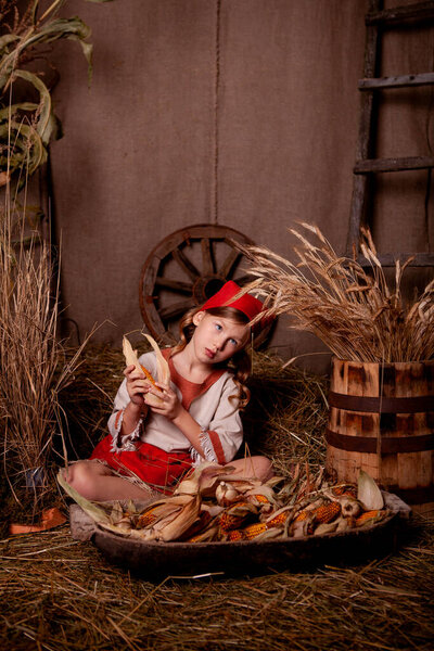 girl in a light linen shirt and a red scarf in a rustic style