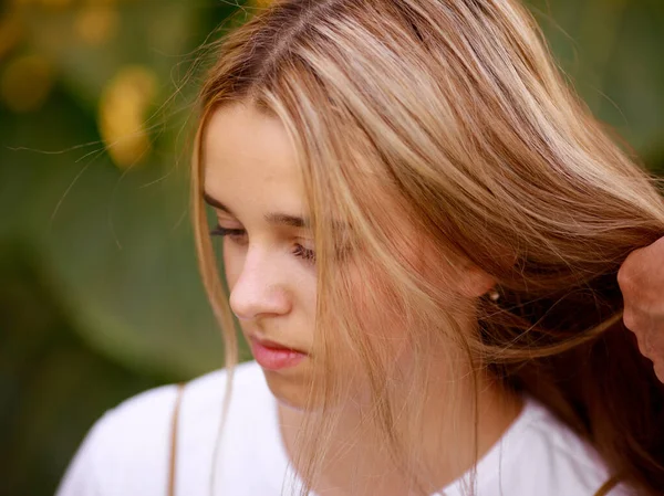 Girl braids hair that flutters