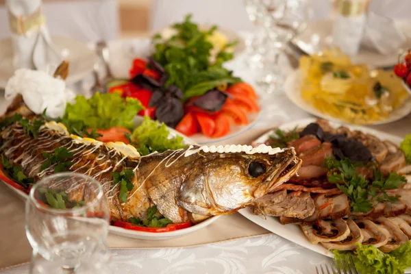 gefilte fish and meats served on the festive table