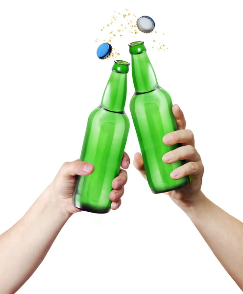 Clink glasses. Two hands holding a bottles. — Stock Photo, Image