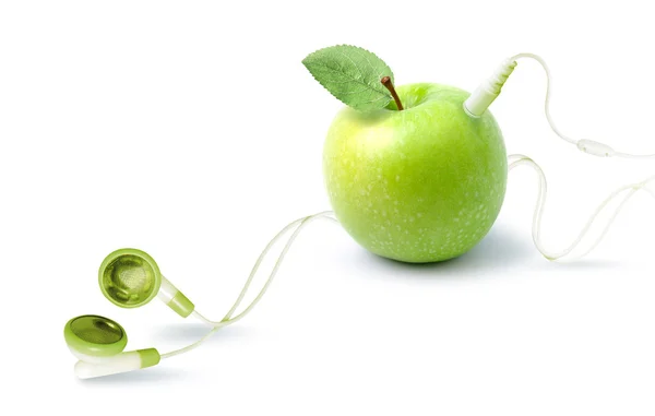 Odtwarzacz muzyki w kształcie jabłka ze słuchawkami. — Zdjęcie stockowe
