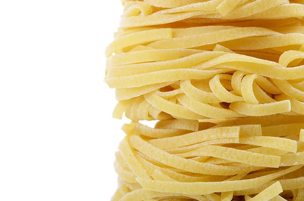 Raw pasta tagliatelle nest — Stock Photo, Image