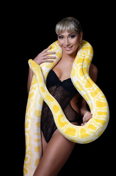 Woman with the big yellow snake — Stock Photo, Image