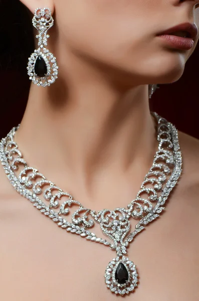 Woman in expensive pendant and earrings — Stock Photo, Image